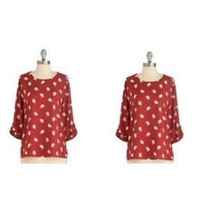 Red top with elephant print